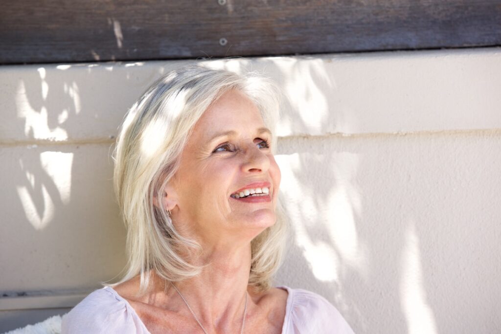 beautiful older woman outside relaxed