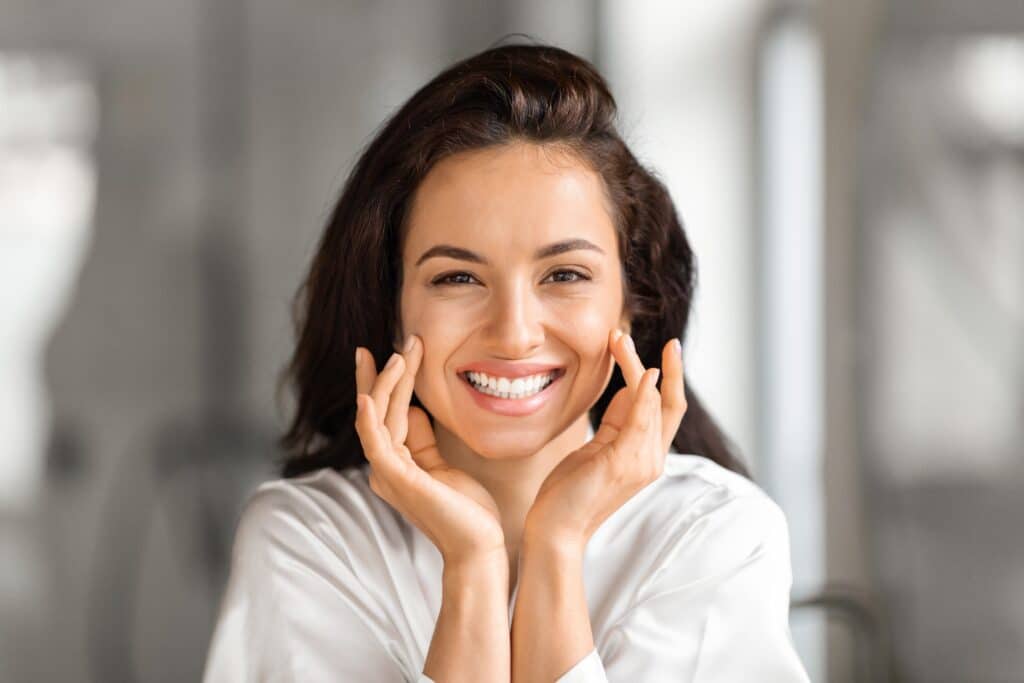 Beautiful, youthful looking woman showing her smooth firm skin from Softwave treatment