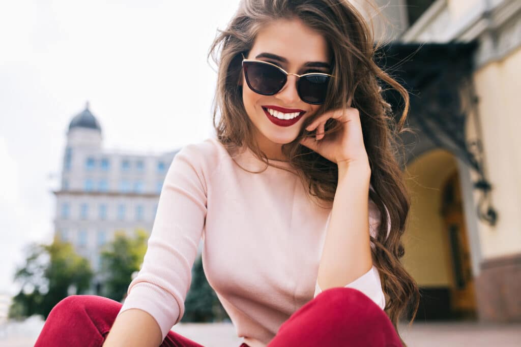 Woman with youthful, smooth skin ready for the holidays from dermal fillers or BOTOX